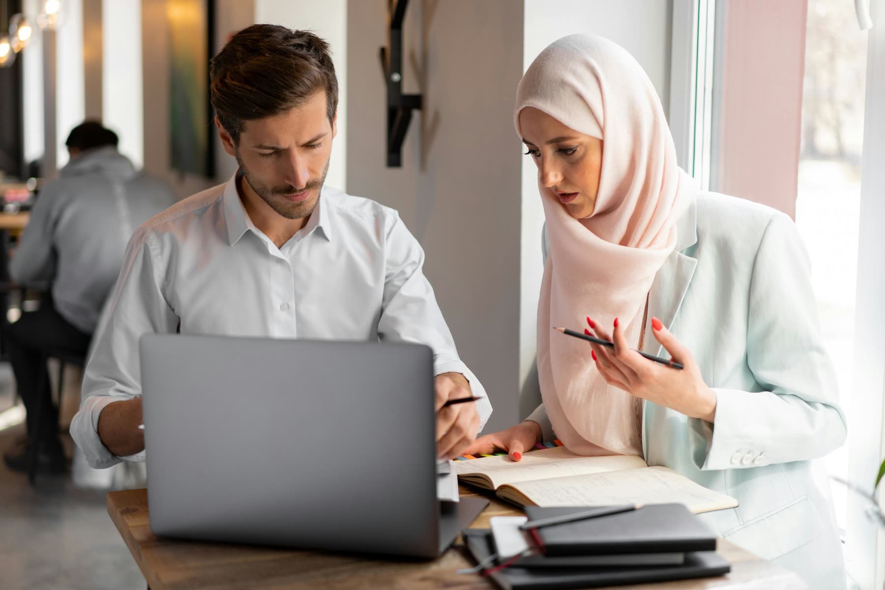 Two colleagues reviewing data together